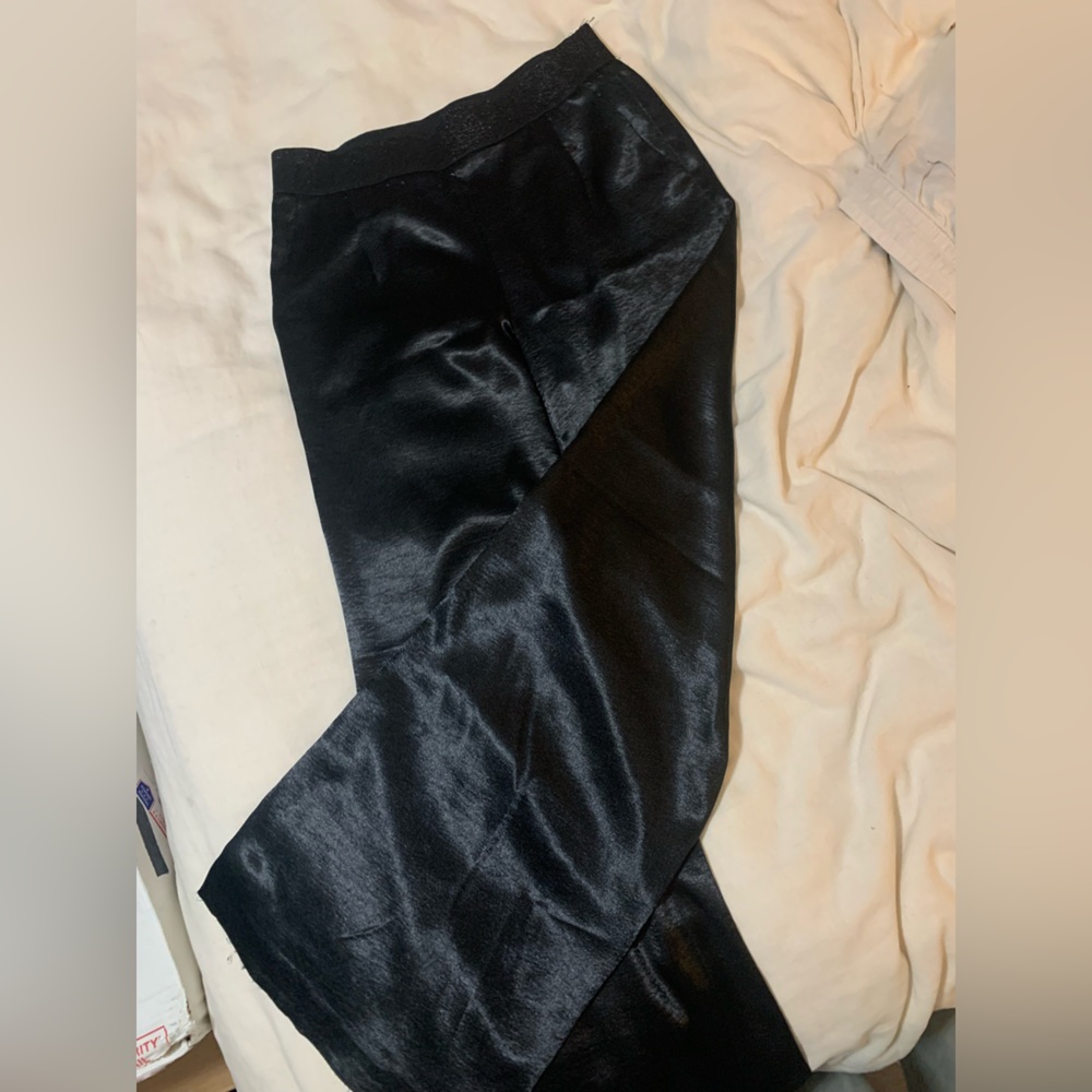 Wide leg shiny black pants.